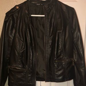 Black jacket with zipper detail on sleeve